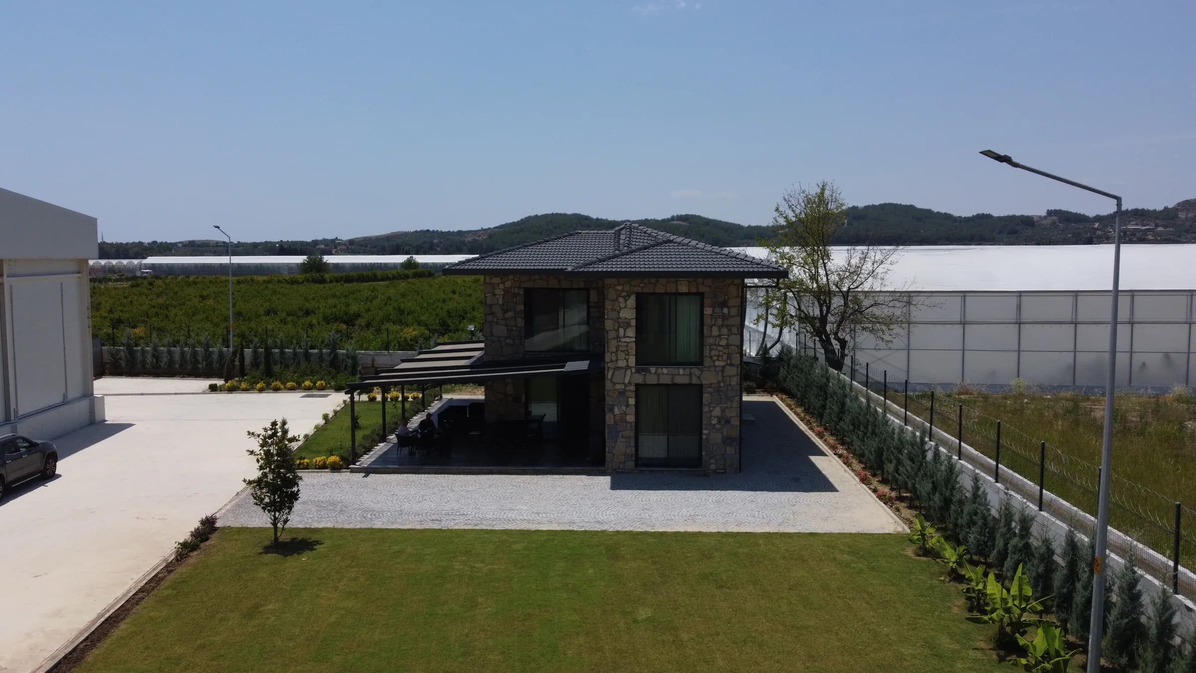 Front view of the stone villa in the factory grounds