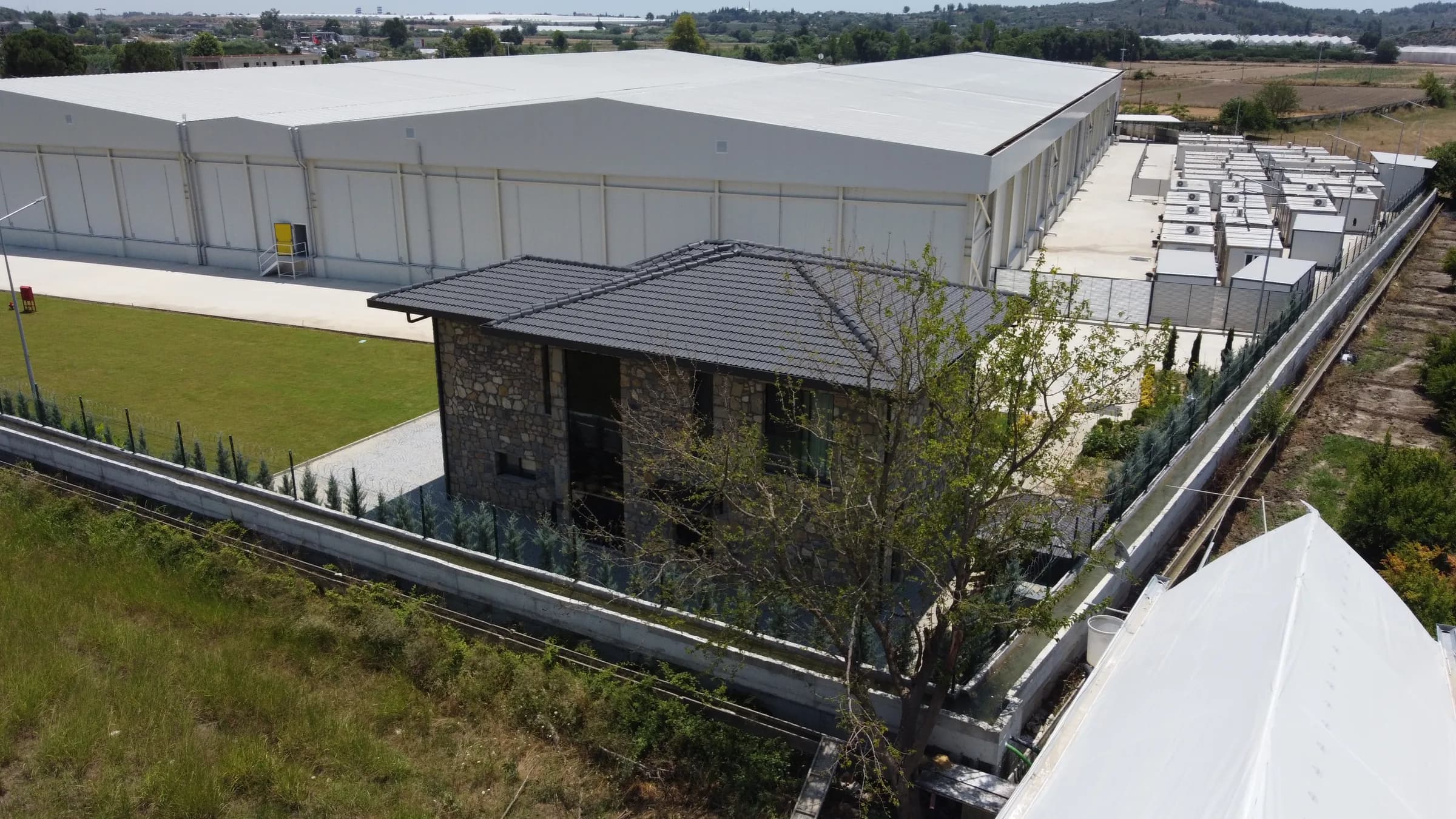 Stone villa and surrounding factory grounds